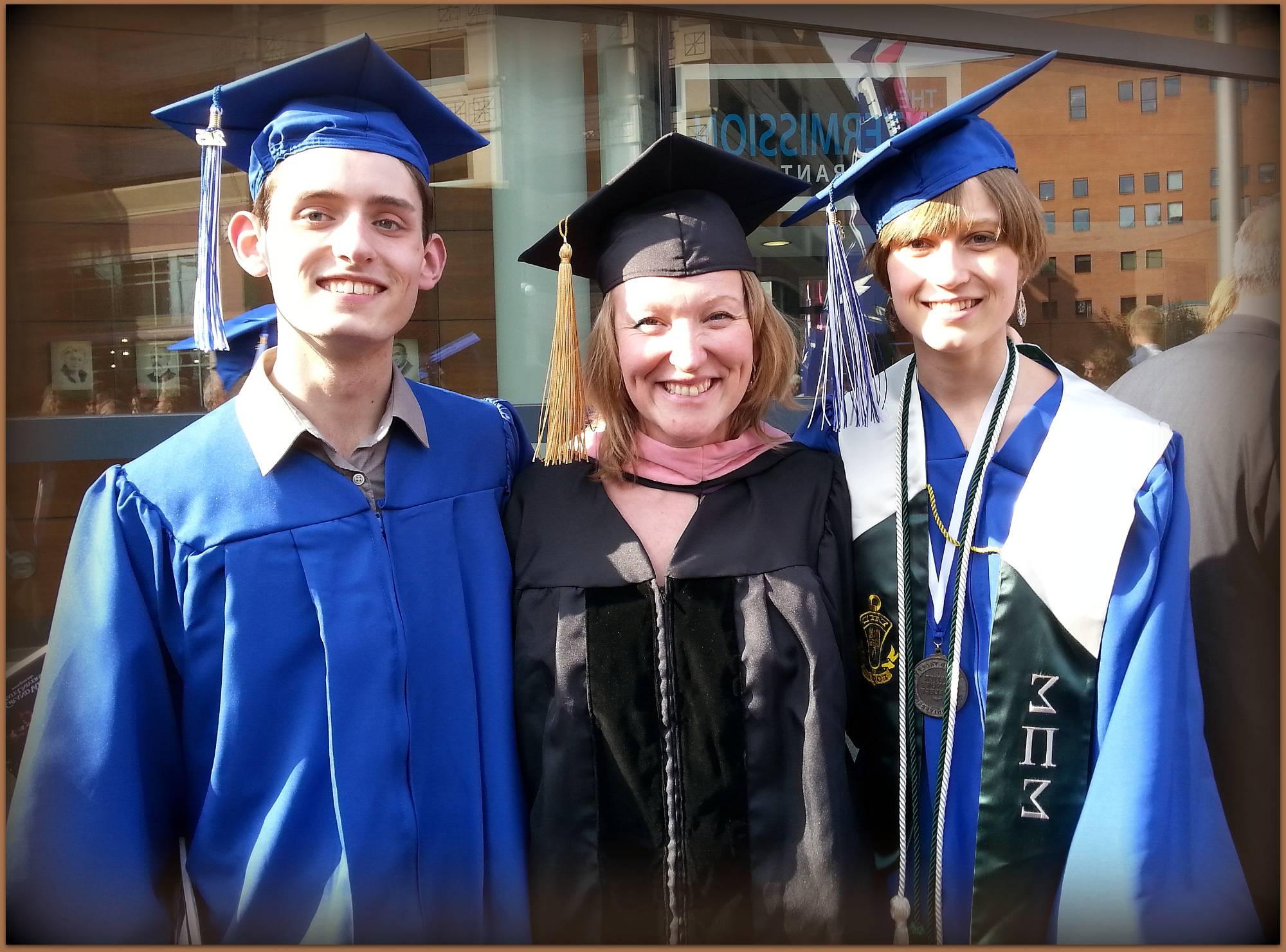 Julia Gjebic and Richie Arndorfer standing in front of Van Andel Arena with Dr. Vavrikova